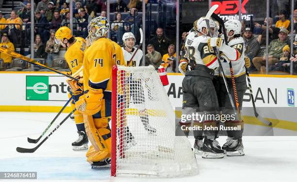 The Vegas Golden Knights celebrate a goal against Juuse Saros of the Nashville Predators during an NHL game at Bridgestone Arena on February 7, 2023...