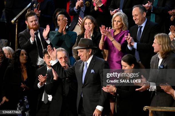 Attendees, including US First Lady Jill Biden and US Second Gentleman Doug Emhoff, applaud Paul Pelosi, husband of US Representative Nancy Pelosi as...