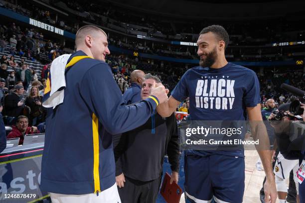Nikola Jokic of the Denver Nuggets talks with Rudy Gobert of the Minnesota Timberwolves after the game on February 7, 2023 at the Ball Arena in...