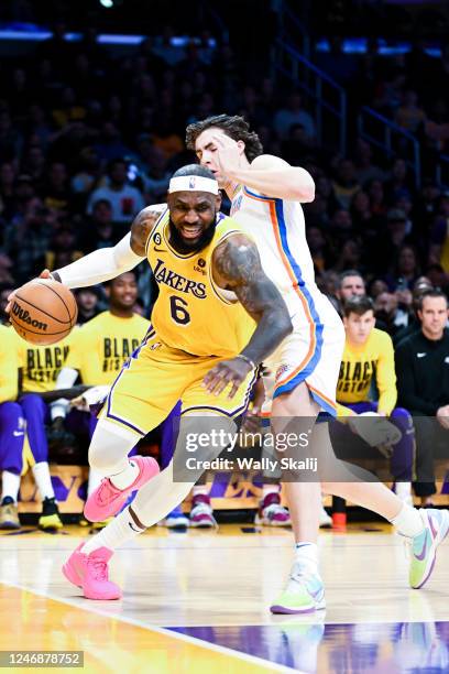 Los Angeles Lakers forward LeBron James drives down the baseline while Oklahoma City Thunder guard Josh Giddey defends during the first quarter at...