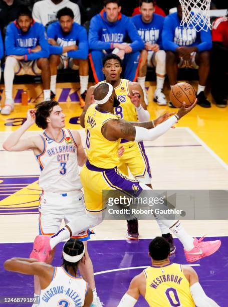 Los Angeles Lakers forward LeBron James goes up for a shot past Oklahoma City Thunder guard Josh Giddey during the third quarter at Crypto.com Arena...