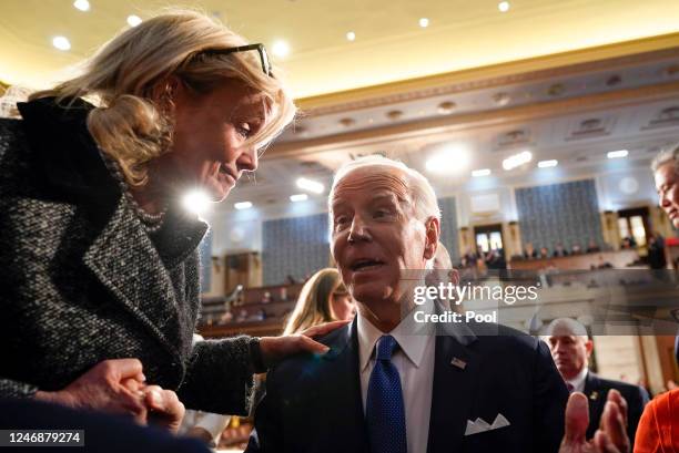 President Joe Biden talks with Rep. Debbie Dingell after the State of the Union address to a joint session of Congress on February 7, 2023 in the...