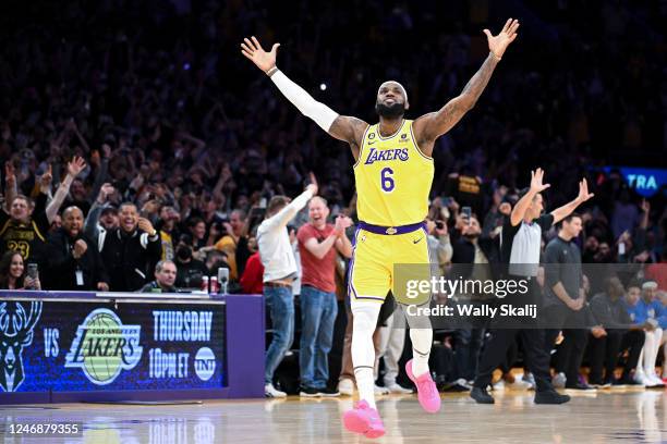 LeBron James celebrates after a shot to become the all-time NBA scoring leader, passing Kareem Abdul-Jabbar at 38388 points during the third quarter...