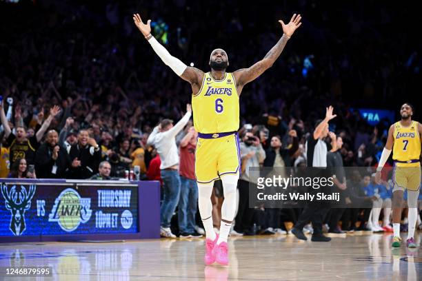 LeBron James celebrates after a shot to become the all-time NBA scoring leader, passing Kareem Abdul-Jabbar at 38388 points during the third quarter...