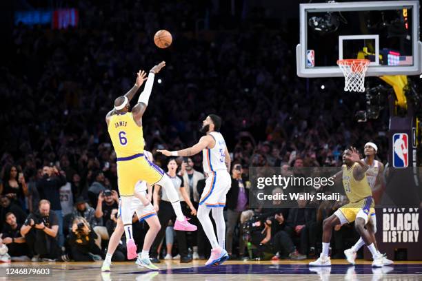 LeBron James shoots a shot to become the all-time NBA scoring leader, passing Kareem Abdul-Jabbar at 38388 points during the third quarter against...