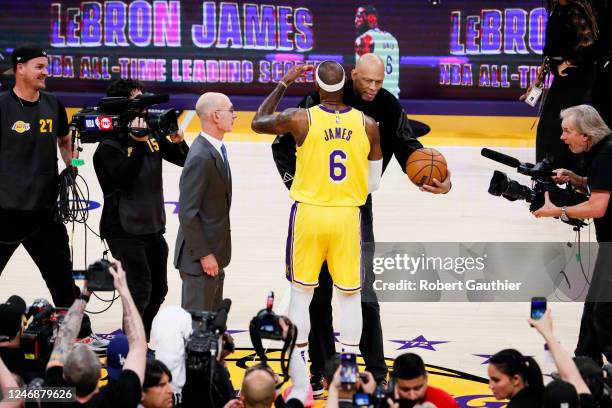 Los Angeles Lakers forward LeBron James hugs Kareem Abdul-Jabbar after making a shot to become the all-time NBA scoring leader, passing Kareem at...