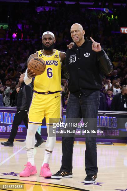 LeBron James of the Los Angeles Lakers poses for a photo with Kareem Abdul-Jabbar after breaking his all time scoring record of 38,387 points during...