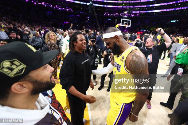 LeBron James of the Los Angeles Lakers talks with Jay-Z after breaking Kareem Abdul-Jabbars, all time scoring record of 38,387 points during the game...