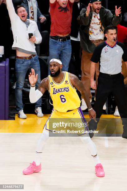 Los Angeles Lakers forward LeBron James celebrates after making a shot to become the all-time NBA scoring leader, passing Kareem Abdul-Jabarr at...