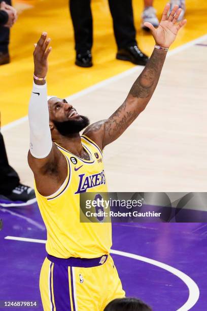 Los Angeles Lakers forward LeBron James celebrates after making a shot to become the all-time NBA scoring leader, passing Kareem Abdul-Jabarr at...