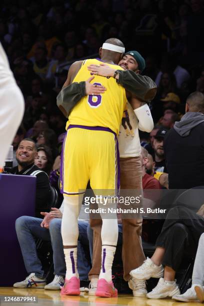 LeBron James of the Los Angeles Lakers hugs Bad Bunny after breaking Kareem Abdul-Jabbars, all time scoring record of 38,387 points during the game...