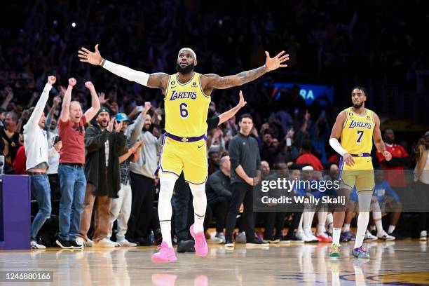 LeBron James celebrates after a shot to become the all-time NBA scoring leader, passing Kareem Abdul-Jabbar at 38388 points during the third quarter...