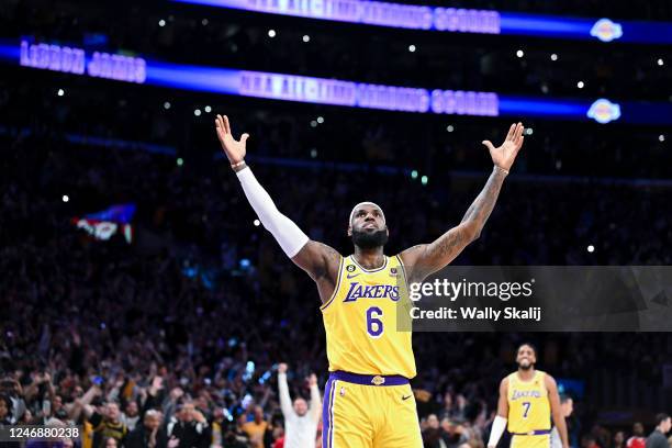 LeBron James celebrates after a shot to become the all-time NBA scoring leader, passing Kareem Abdul-Jabbar at 38388 points during the third quarter...