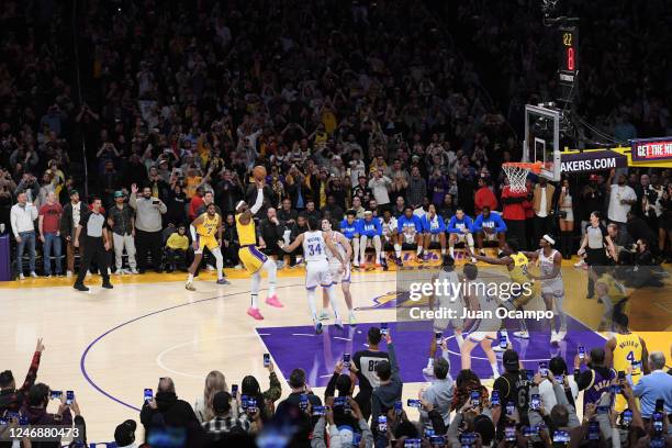 LeBron James of the Los Angeles Lakers shoots the ball to break Kareem Abdul-Jabbar's all time scoring record of 38,388 points during the game...