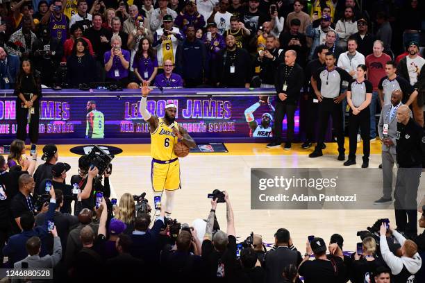 LeBron James of the Los Angeles Lakers waves to fans after breaking Kareem Abdul-Jabbars all time scoring record of 38,388 points during the game...