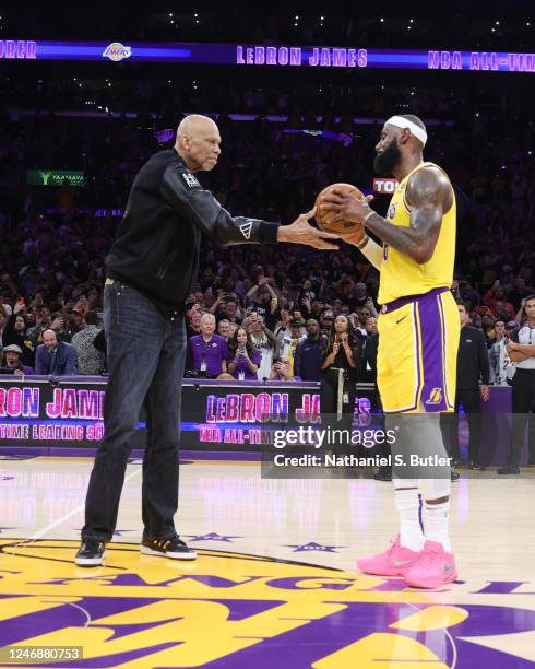 Kareem Abdul-Jabbar celebrates after LeBron James of the Los Angeles Lakers breaks his all time scoring record of 38,387 points during the game...