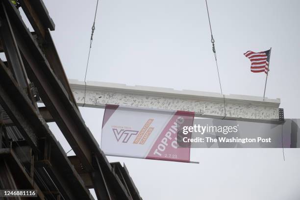 The ceremonial lifting of a steel beam to the highest point, the 11th story o the Academic Building One on the Virginia Tech Innovation Campus in...