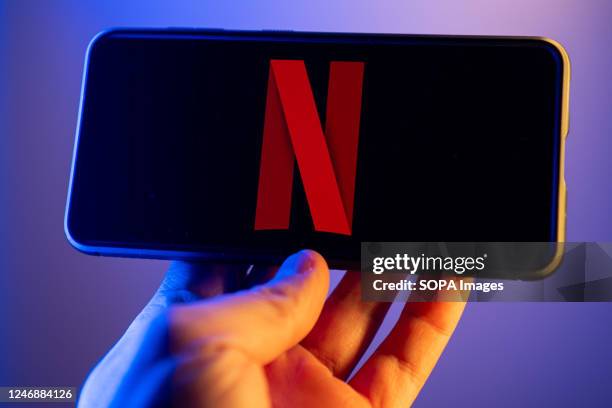 In this photo illustration, a Netflix logo seen displayed on a smartphone.