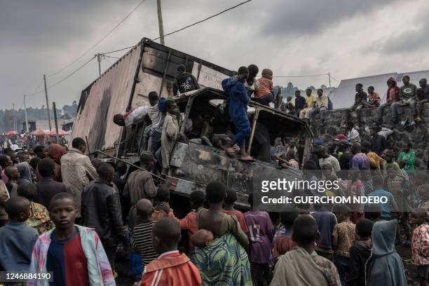 Residents dismantle a vehicle belonging to the United Nations Stabilization Mission in the Democratic Republic of Congo in Kanyaruchinya, Nyiragongo...