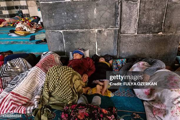 People rest in the historical Grand Mosque, where they found refuge, two days after a strong earthquake struck the region, in the southeastern...