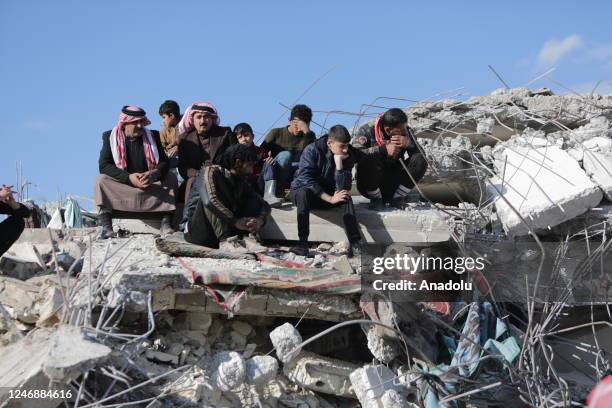 People grieve near collapsed building after 7.7 and 7.6 magnitude earthquakes hit multiple provinces of Turkiye and Syria on February 08, 2023. As a...