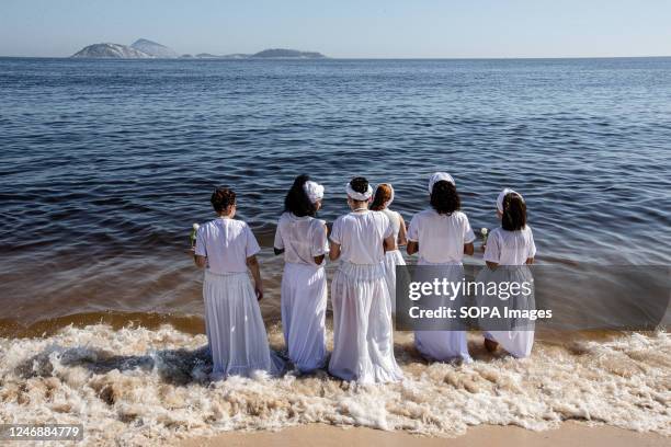 Devotees pray and jump waves in celebration of Iemanjá, the west-African goddess of the sea. In the event modeled after the celebrations on the Rio...