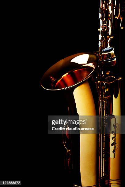 saxophone with black background. color image - brass instrument stock pictures, royalty-free photos & images