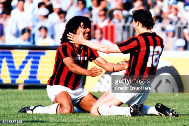 Marco van Basten of AC Milan celebrates scoring his side's third goal with his team mate Ruud Gullit of AC Milan during the Serie A match between...