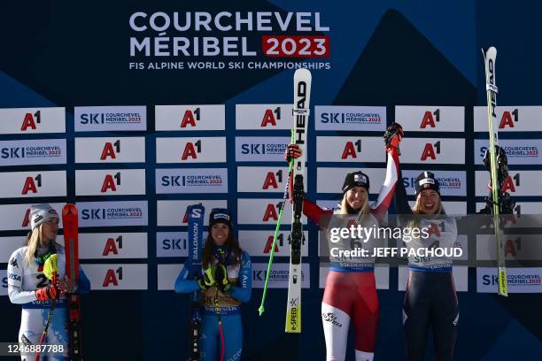 Tied for third-placed Austria's Cornelia Huetter and Norway's Kajsa Vickhoff Lie celebrate on the podium as Second-placed US Mikaela Shiffrin and...