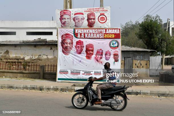 General view of a campaign billboard of the candidate of New Nigeria Peoples Party Rabiu Kwankwaso and other party stalwarts seeking election...