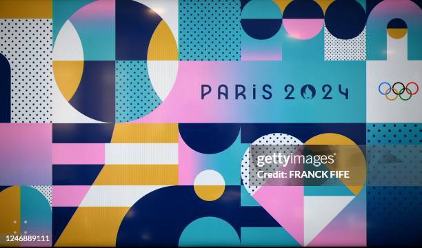 This photograph taken on February 8 shows the logo, dominant colours and visual identity for the Paris 2024 Olympic and Paralympic Games, during the...