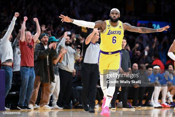 LeBron James celebrates after a shot to become the all-time NBA scoring leader, passing Kareem Abdul-Jabbar at 38388 points during the third quarter...