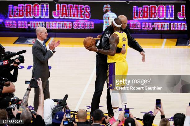 LeBron James, right, hugs Kareem Abdul-Jabbar after becoming the all-time NBA scoring leader, passing Kareem Abdul-Jabbar at 38388 points during the...