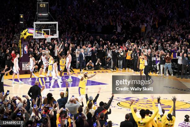 LeBron James celebrates after making a shot to become the all-time NBA scoring leader, passing Kareem Abdul-Jabbar at 38388 points during the third...