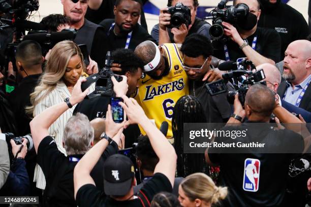 LeBron James celebrates with his sons Bronny and Bryce Maximus after becoming the all-time NBA scoring leader, passing Kareem Abdul-Jabbar at 38388...