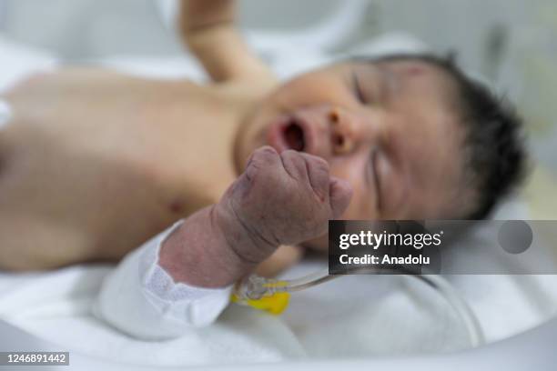 Baby girl, who was born under the rubble in the town of Jinderis located in Syria's Idlib district, receives treatment inside an incubator at a...