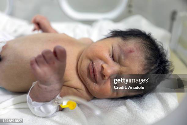 Baby girl, who was born under the rubble in the town of Jinderis located in Syria's Idlib district, receives treatment inside an incubator at a...