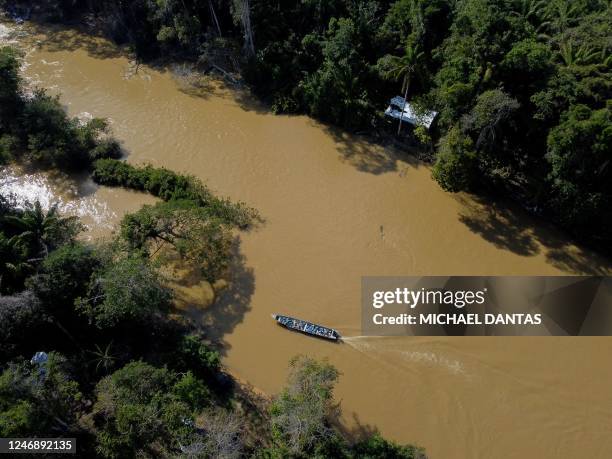 Aerial view of Porto do Arame, located on the banks of the Uraricoera river, which is the main access point for people trying to leave illegal mining...