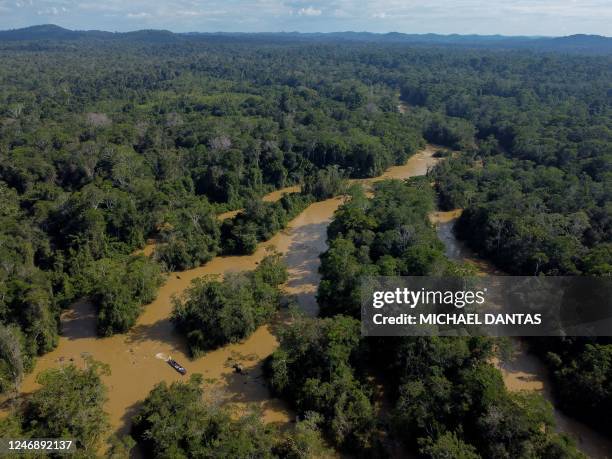 Aerial view of Porto do Arame, located on the banks of the Uraricoera river, which is the main access point for people trying to leave illegal mining...