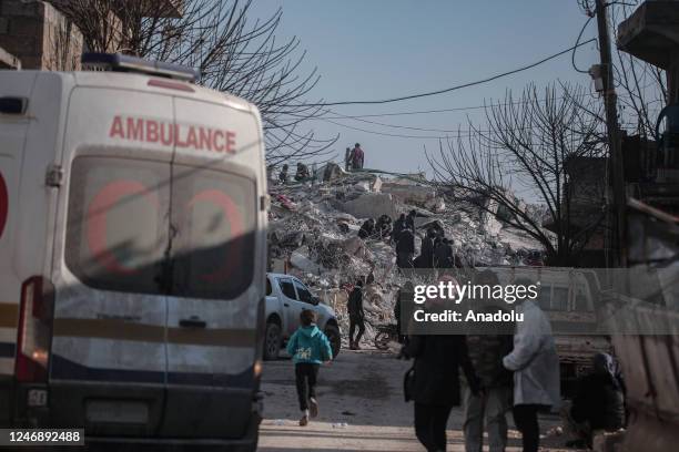 Personnel and civilians conduct search and rescue operations in Afrin district of Aleppo, Syria after 7.7 and 7.6 magnitude earthquakes on February...