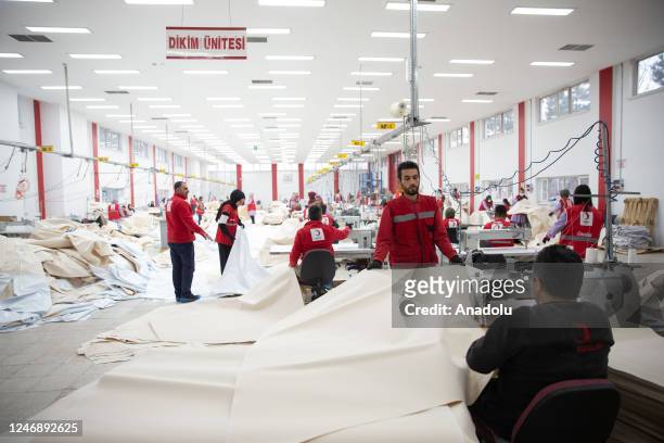 Members of Turkish Red Crescent make textile tents in the Tent Textile Department, which has been producing disaster tents for 70 years at the...