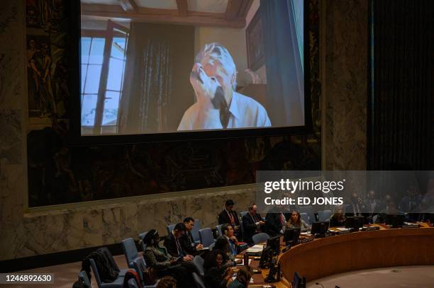 British musician Roger Waters and his dog are displayed on a screen during an address to a UN Security Council meeting on Ukraine, at UN headquarters...