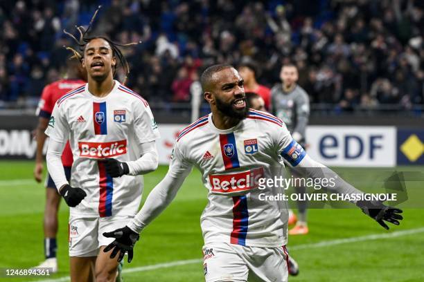 Lyon's French forward Alexandre Lacazette celebrates scoring his team's second goal during the French Cup round of 16 football match between...