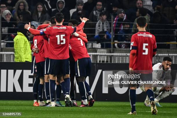 Lille's players celebrate after scoring a goal during the French Cup round of 16 football match between Olympique Lyonnais and Lille OSC at the...