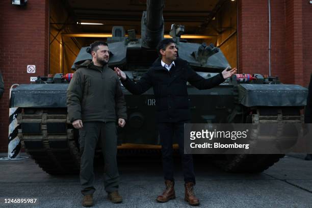 Volodymyr Zelenskiy, Ukraine's president, left, and Rishi Sunak, UK prime minister, meet with tank crews from Ukraine's armed forces being trained to...