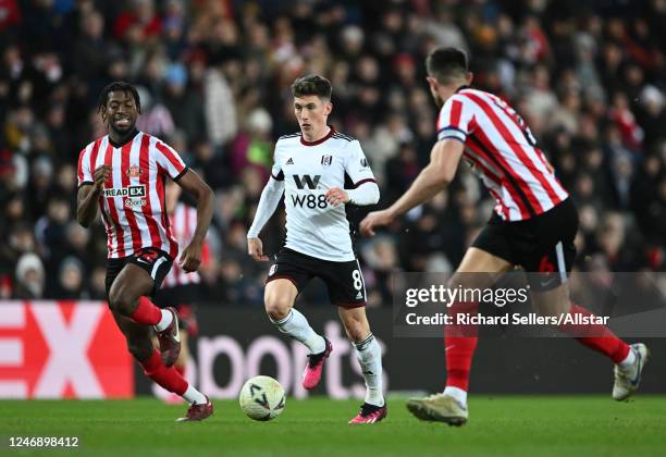 Aji Alese of Sunderland, Harry Wilson of Fulham and Danny Batth of Sunderland on the ball during the FA Cup Fourth Round replay match between...