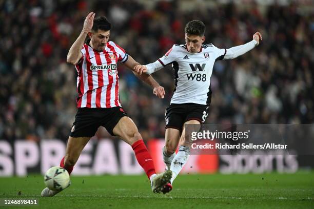 Danny Batth of Sunderland and Harry Wilson of Fulham challenge during the FA Cup Fourth Round replay match between Sunderland FC and Fulham FC at...