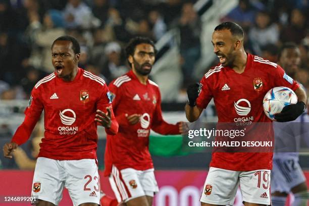 Ahly's Egyptian midfielder Mohamed Afsha and Ahly's South African forward Percy Tau celebrate their team's first goal during the FIFA Club World Cup...