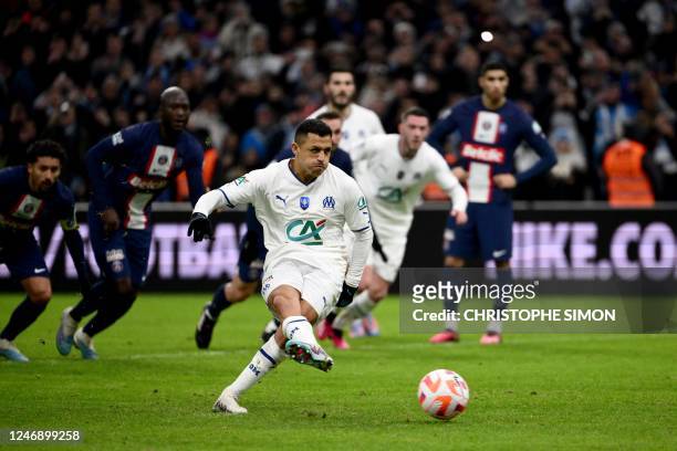 Marseille's Chilean forward Alexis Sanchez shoots from the penalty spot scoring his team's first goal during the French Cup round of 16 football...