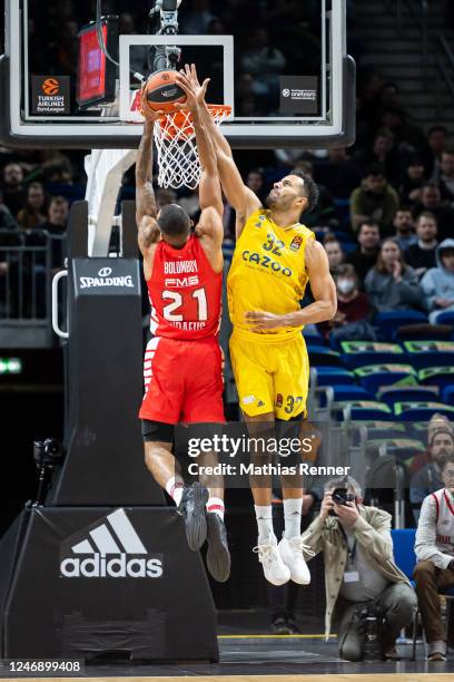 Joel Bolomboy of Olympiakos Piraeus and Johannes Thiemann of ALBA Berlin during the Turkish Airlines Euroleague match between ALBA Berlin and...